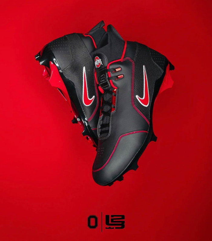 View of black and red Nike cleats.